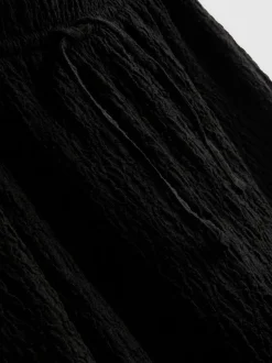 Pantalones fruncidos de pernera recta con cordón