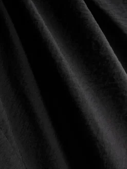 Pantalones fruncidos de pernera ancha