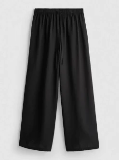 Pantalones fruncidos de pernera ancha
