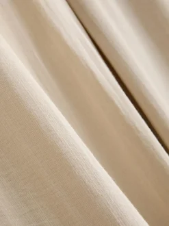 Pantalones palazzo con detalle de lazo
