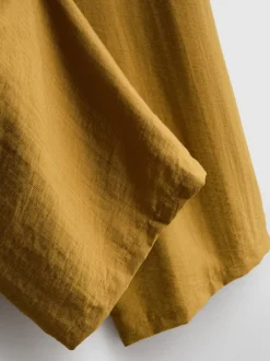 Pantalones palazzo con detalle de lazo