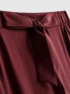 Pantalones palazzo con detalle de lazo