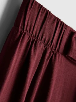 Pantalones palazzo con detalle de lazo