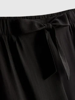 Pantalones palazzo con detalle de lazo
