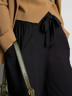 Pantalones palazzo con detalle de lazo