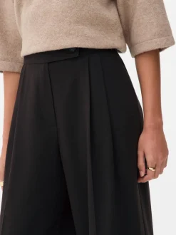 Pantalones plisados de talle medio