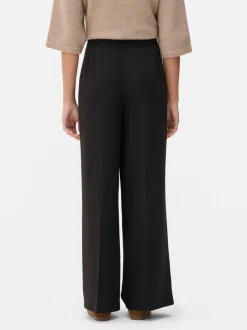 Pantalones plisados de talle medio