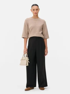 Pantalones plisados de talle medio