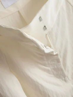 Pantalones plisados fruncidos de pernera ancha