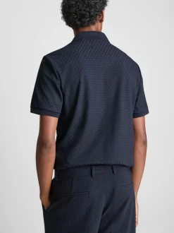 Polo con cremallera y textura de The Edit