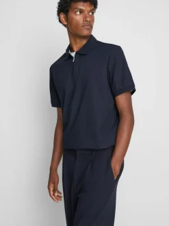 Polo con cremallera y textura de The Edit