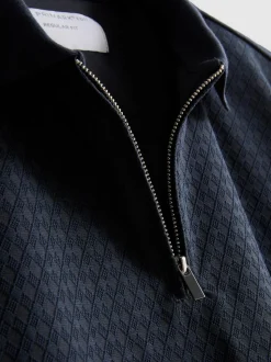 Polo con cremallera y textura de The Edit