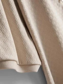 Polo con cremallera y textura de The Edit