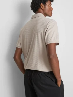 Polo con cremallera y textura de The Edit