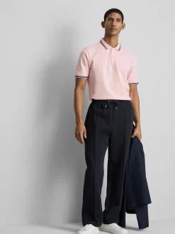 Polo con cuello y ribetes