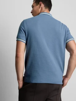 Polo con textura y cuello con cremallera