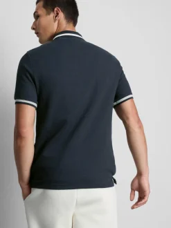 Polo con textura y cuello con cremallera