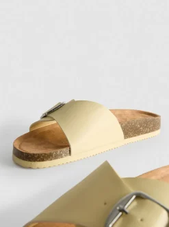 Sandalias destalonadas con tira con hebilla
