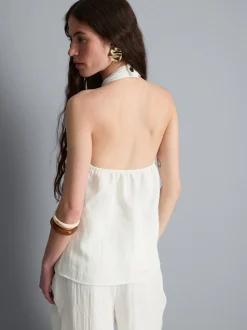 Top con cuello halter, botones y textura