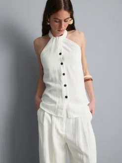 Top con cuello halter, botones y textura