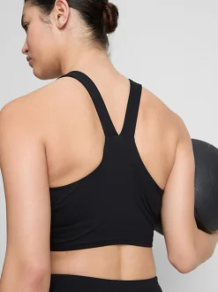 Top corto deportivo con cuello de pico y sujeción suave