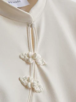 Top de cuello mao