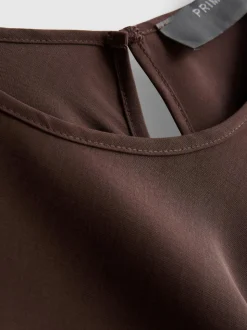 Top fluido con bajo asimétrico