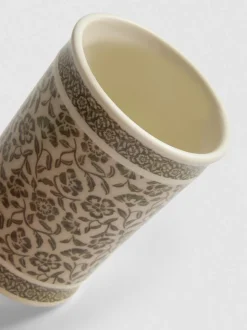 Vaso de baño con flores