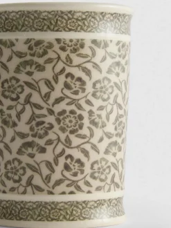 Vaso de baño con flores