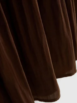 Vestido midi con bajo caído