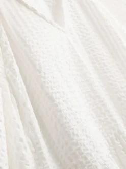 Vestido midi con volantes en sirsaca de algodón